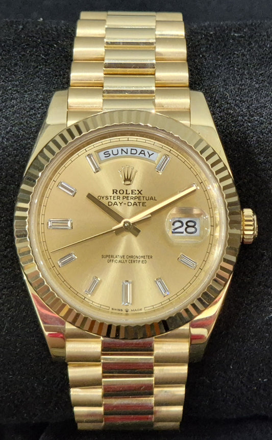 Rolex Day-Date 40 Yellow Gold Champagne Baguette Diamond Dial 228238 front