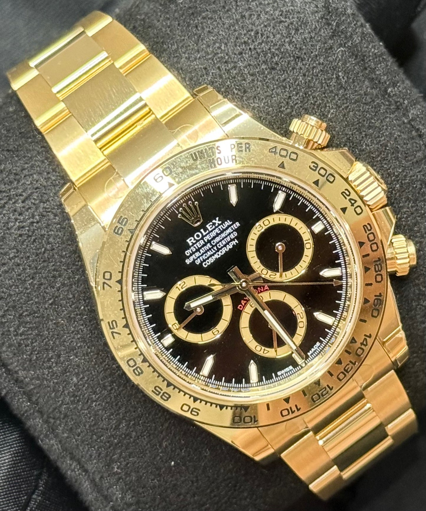 Rolex Cosmograph Daytona Yellow Gold Black Dial with Gold Rings 126508 front left